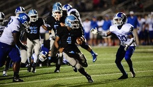 Spain Park running back Wade Streeter (4) skirts a Tuscaloosa County defender as he sprints for a touchdown in the fourth quarter of the Jaguars' 24-0 win over the Wildcats on Sept. 11. (Reporter Photo/Neal Wagner)