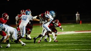 Spain Park's Larry Wooden sprints past a Hewitt-Trussville defender during the Jaguars' 31-28 victory over the Huskies on Sept. 18. (Reporter Photo/Neal Wagner)