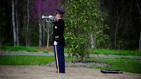 A U.S. Army bugler plays taps as Matthew Blount is laid to rest in 2012. (File)