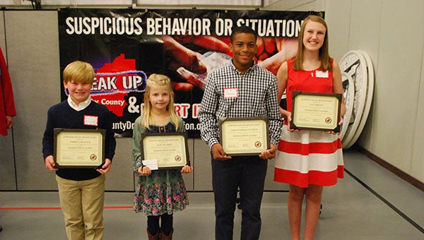 From left to right: Forrest Heacock, Kate Hendrix, J.T. Watkins and Cana Brown were all given Character in Action Awards for their outstanding character on Thursday, Sept. 17. (Reporter Photo/Graham Brooks)