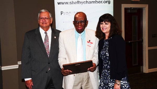 Eddie Huggins, center, received the Citizens Observer Patrol of the Year award for the city of Chelsea at this year's Safety Awards Luncheon hosted by the Greater Shelby County Chamber of Commerce on Sept. 30. (Reporter Photo/Neal Wagner)