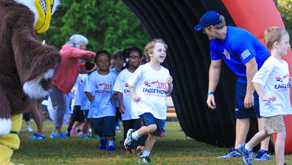 Cheered on by friends and family, IES student enter the course for their Eaglethon Fun Run on Oct. 8. (For the Reporter / Dawn Harrison)