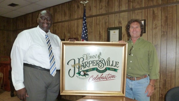 Mayor Theoangelo Perkins holds hand-painted framed painting of Harpersville Bicentennial logo created, designed, painted and framed by Scott Owen as a gift to Harpersville. (CONTRIBUTED)