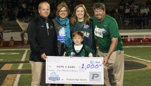 Gabe Griffin and his family received a $1,000 check from AT&T-Alabama's "It Can Wait" Challenge. The Hope for Gabe Foundation was Pelham High School's chosen charity. (For the reporter / Dawn Harrison)
