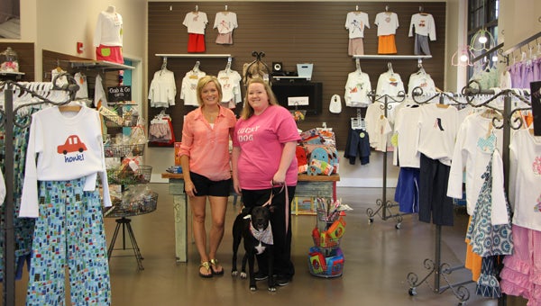Pictured from left: Kim Anderson, owner of Favorite Laundry, and Magan Hall, owner of Lucky Dog, with dog Sasha. Both Favorite Laundry and Lucky Dog are participating in this year's JLB Shop Save & Share program. (Contributed)