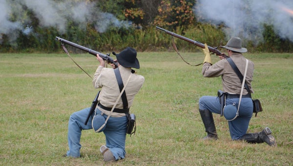 Civil War reenactors recreate a battle during the Cotton Pickin' Festival at Old Baker Farm on Oct. 25. (Reporter Photo / Emily Klein)