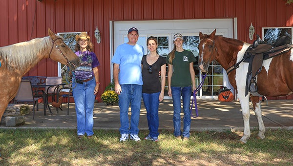 Dave and Amy Horrie (Center) are looking to adopt their second child and a fundraiser ride for the couple was held on Tuesday, Oct. 6 at the Stamps Farm in Montevallo. (For the Reporter/Dawn Harrison)