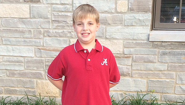 FIfth-grader Logan Robbins prepares to enter Alabaster City Hall to present to the City Council on Oct. 8. (Contributed)