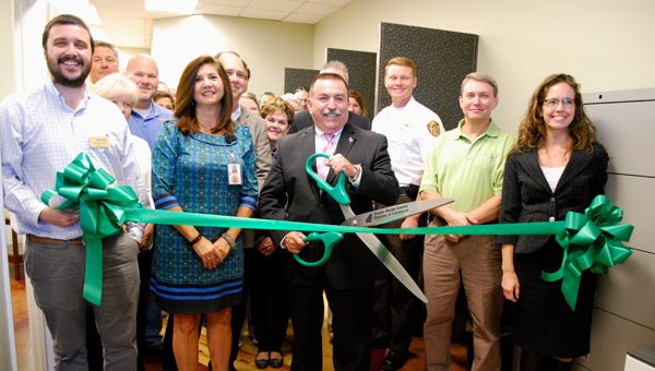 Shelby County Sheriff John Samaniego cuts the ribbon on the new SCSO North Substation on Oct. 19. (Reporter Photo / Molly Davidson)