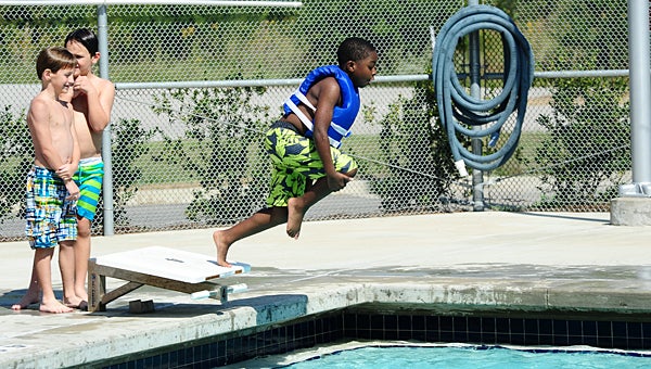Meadow View Elementary School second-grader Brayden Gosha jumps into the Alabaster YMCA pool during the school system's learn to swim program on Oct. 8. (Reporter Photo/Neal Wagner)