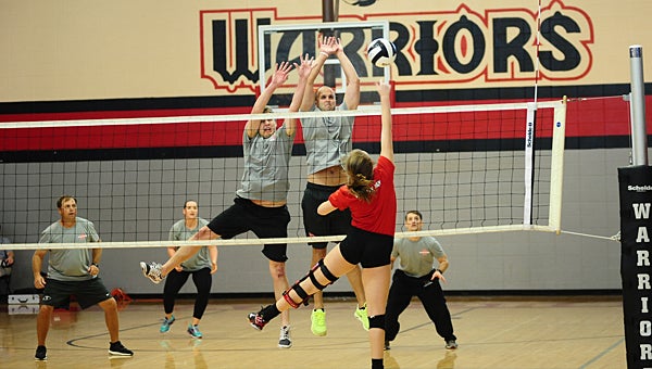 Thompson High School faculty members square off against the school's varsity volleyball squad during an Oct. 1 charity match. (Reporter Photo/Neal Wagner)