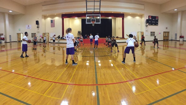 The Montevallo women's basketball team works with local middle schoolers on basketball fundamentals. (Contributed)