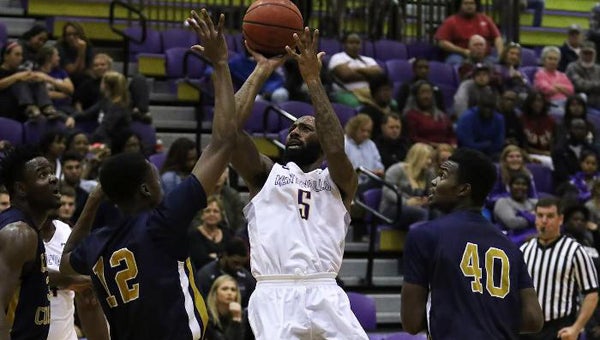 Bryant Orange goes up for a tough bucket in the lane during Montevallo's season opener against Carver College on Nov. 13. The Falcons got their first win of the season, 93-72. (Contributed)