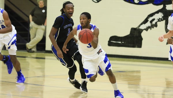 Aaron Washington of Chelsea leads the Hornets' fast break during their second round game in the North Shelby Tip-Off Classic on Nov. 24. (For the Reporter / Dawn Harrison)