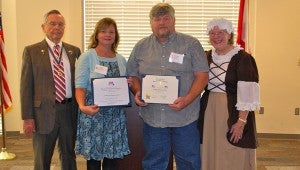 SAR Cahaba-Coosa Chapter President John Walker, far left, and DAR David Lindsay Chapter Regent Phoebe Robinson, far right, stand with Kim and Butch Phillips with Double Tap Training Grounds. (Reporter Photo / Molly Davidson)