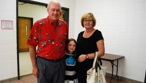 Katie Byrd, center, stands with her Nannie, Kaye Byrd, and Birdie, Palmer Byrd, on Grandparents Day. (Reporter Photo / Molly Davidson)