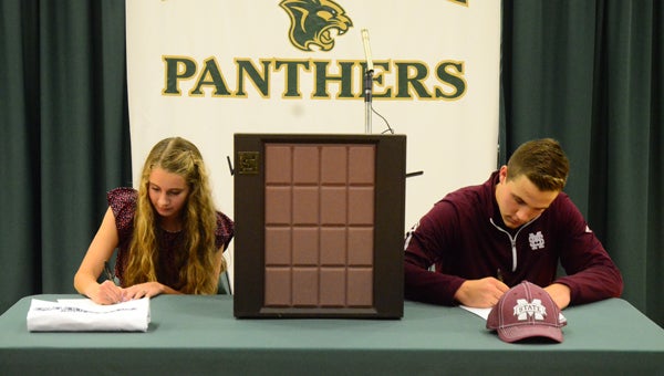 Pelham High School athletes Mary Grace Strozier and Cole Whitman signed with Samford University and Mississippi State University, respectively, Nov. 11. (Reporter photo / Jessa Pease)    