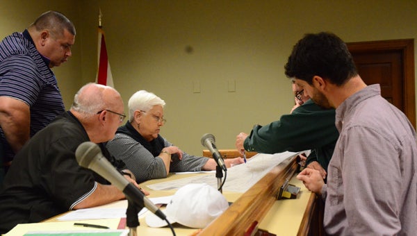 Pelham’s Planning Commission members and city engineer, Eddie Jowers, look over the final plans for the Keeneland Valley subdivision. (Reporter photo / Jessa Pease)  