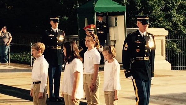 Students from Mt Laurel, Forest Oaks and Chelsea Park elementary schools participate in a wreath laying ceremony at the Tomb of the Unknown Soldier during a joint field trip to Washington, D.C. (Contributed)