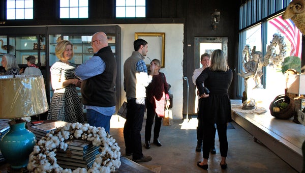 Guests chat at Black Sheep Antiques on Nov. 14 during a book signing event with Atlanta-based interior designer, Barbara Westbrook. (Reporter Photo / Molly Davidson)