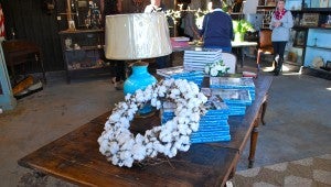 Interior designer Barbara Westbrook signed copies of her newest book, "Gracious Rooms," during the Nov. 14 book signing at Black Sheep Antiques. (Reporter Photo / Molly Davidson)