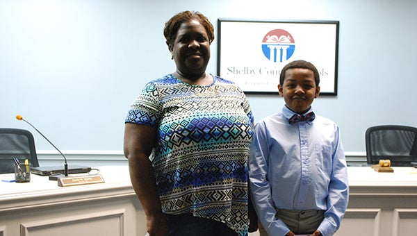 Gwendolyn Brown and her son Jackkob, attended the Nov. 19 Shelby County Board of Education meeting to praise the teachers and administration at Helena Intermediate School. Reporter Photo/Graham Brooks
