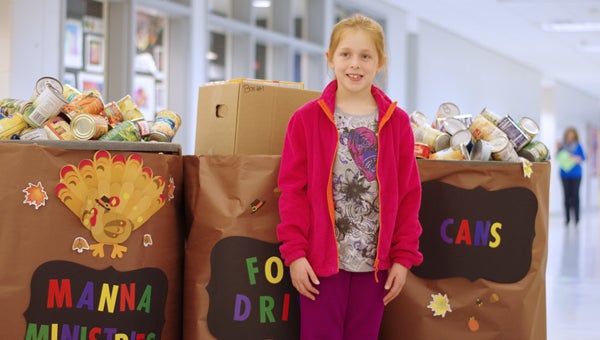 Meadow View Elementary School second-grader Lynleigh Weltzin has helped to lead a successful charity food drive at the school over the past few weeks. (Reporter Photo/Neal Wagner)