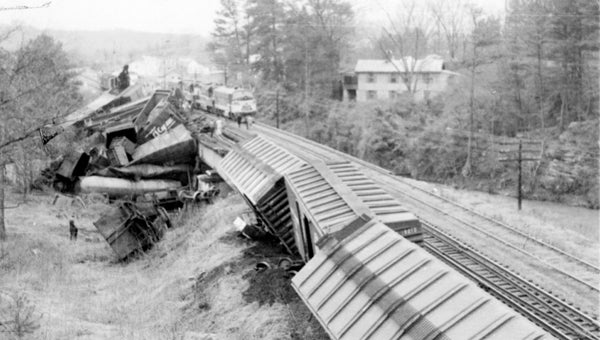 Creek full of cars: This April 29, 1959 photo was taken after a northbound L&N freight train derailed while crossing Buck Creek near downtown Helena. While no one was killed in the wreck, a crane operator, while attempting to clear the track, was fatally injured when his machine toppled over into the creek. (Contributed/City of Helena Museum)
