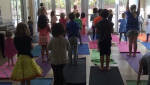 Kids learn yoga during the first afterschool meeting of the Hilltop Health Club. Many more fun activities are planned for the rest of the year. (Contributed)