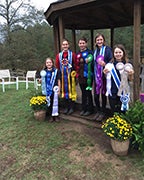 The riders show off their ribbons after competing in a national horse show. (Contributed)