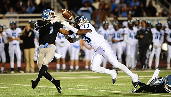 Spain Park’s Chase Young (1) fights James Clemens’ Torolla Walker (13) for a pass during the Jags’ 13-10 victory over the Jets on Nov. 13 in Hoover. (Reporter Photo/Neal Wagner)