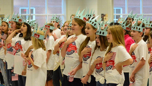 Chelsea Park Elementary School fifth graders say a pledge during their Super Citizens Program graduation held by the Liberty Learning Foundation on Nov. 12. (Reporter Photo/Emily Sparacino) 