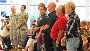 Local veterans stand to be honored during the Meadow View Elementary School Veterans Day program on Nov. 6. (Reporter Photo/Neal Wagner)