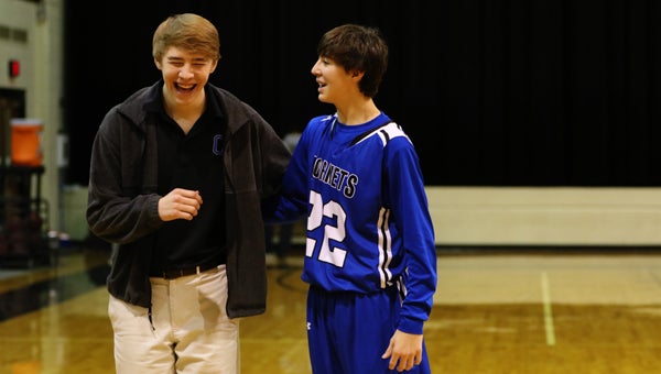 Stephen Lanzi and Joseph Lanzi share a laugh together after Chelsea played Pell City in January of 2015. Joseph, who normally wears No. 5, iwore his older brother's jersey in the game.  (Contributed / Cari Dean)