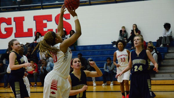 Jordan LeNoir goes up for an inside bucket against Briarwood's Molly McKenzie in the championship game of the Shelby County tournament. (Reporter Photo / Baker Ellis)