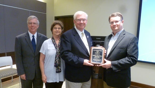 Bobby Joe Seales won the Marvin Yeomans Whiting Award, the highest award given by the Society of Alabama Archivists. Pictured are Dr. Fred Olive, president of the Shelby County Historical Society, Diane and Bobby Joe Seales, and Jim Baggett, head of the Department of Archives and Manuscripts at the Birmingham Public Library. (Contributed)