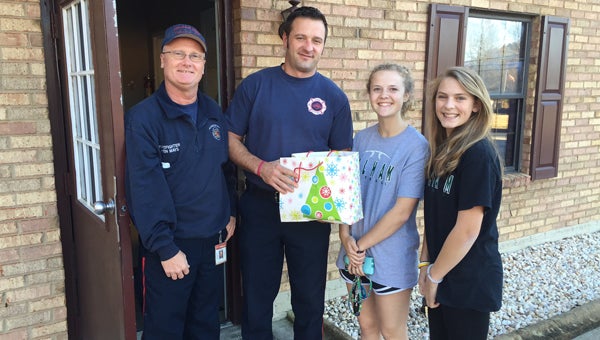 Pelham High School softball players surprise Pelham firefighters with a care package Dec. 3. (Contributed)