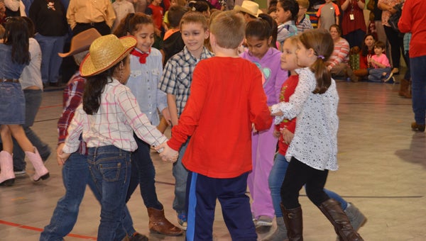 Students in second grade at Valley Elementary square dance at the school’s annual Barn Dance Dec. 18. (Reporter photo / Jessa Pease)