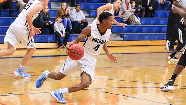 Helena’s Jaylen Harris (4) looks to push the ball up the floor in transition. (For the Reporter/Dawn Harrison)