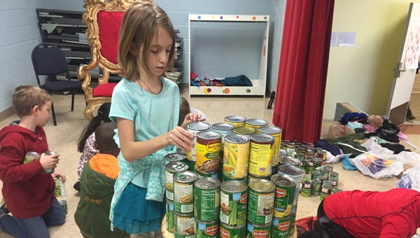 VES students created the Statue of Liberty’s torch using canned goods as entry in the "Can Do Good" Social Design Competition. (Contributed)