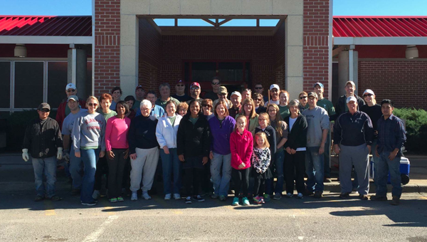 More than 40 volunteers from First Christian Church of Birmingham help to transform VES’s courtyard. (Contributed)  