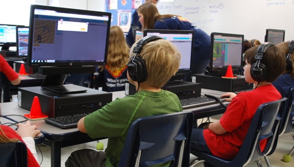 Oak Mountain Elementary School students program during a December 2015 lesson. The state is expanding its number of computer science-trained teachers. (File)