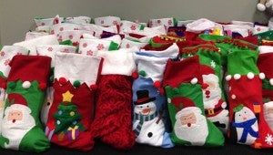 Kids stuffed hundreds of stocking with goodies for the children served by VFS’s BackPack Buddies program. (Contributed) 