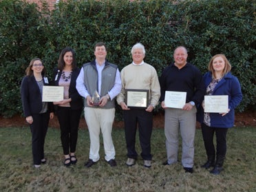 Davis Drug (center) was named the 2015 Business of the Year. Other nominees were St. Vincent's One Nineteen Health and Wellness (left), Mundy Motors (second from right), American Tree Maintenance (far right), Columbiana Clinic, Shelby Baptist Association and Stone Hollow Farms. (Reporter Photo/Emily Sparacino)