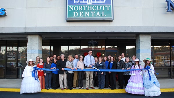 Helena city leaders and members of Northcutt Dental celebrated a grand opening celebration on Dec. 3 in Helena. (Reporter Photo/Graham Brooks)