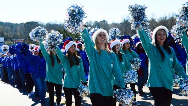 Members of the Chelsea High School Marching Band make their way along Shelby County 47 during the 2015 Chelsea Christmas Parade on Dec. 19. (Reporter Photo/Emily Sparacino)