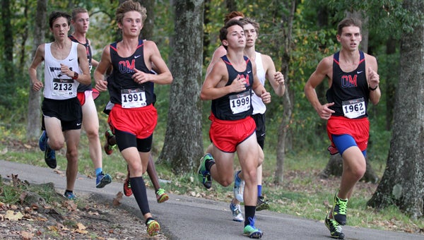 Cole Stidfole (front left) is one of the early frontrunners to take home the 7A 1,600-meter and 3,200-meter titles in 2015. (File)