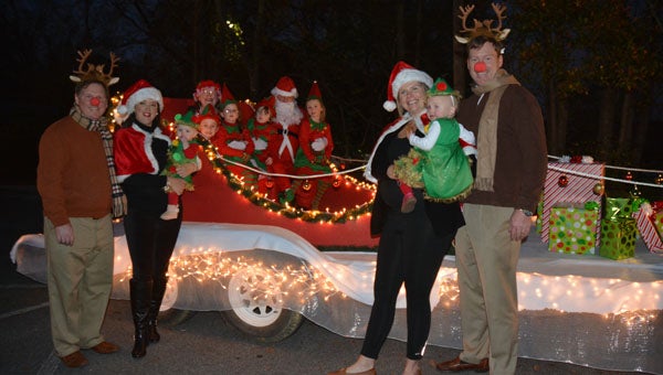 The Robinson family rode in the Columbiana Christmas Parade grand marshal float made by Robert, Donald and Katie Robinson. Pictured are Robert, Katherine Sarah Turnley, Tripp, Rushton and Jackson Robinson, Mrs. Santa Claus, Grand Marshal Phoebe Donald Robinson, and Santa Red Robinson, Bird, Katie, Fifi and Donald Robinson. (Contributed)
