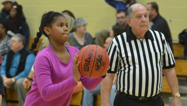Mt Laurel student Sophia Brown takes first place in the 10-11 girls category at the Cahaba Valley Elks Lodge Hoop Shoot Competition, making 16 out of 25 shots. (Reporter photo / Jessa Pease) 