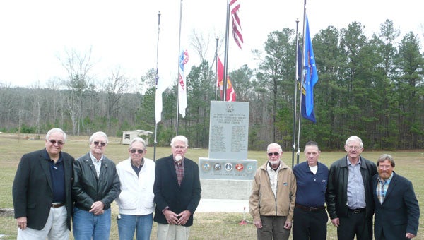 The K-Springs Cemetery Veterans Memorial, Inc. committee stand in front of the new memorial on Highway 39 in Chelsea where 43 veterans are laid to rest in the cemetery: Gus Speary, Larry McCrory, Kenneth L. Nivens, W.J. Ferguson, Ray Shirley (chair), Jimmie Adkins, Jr., Jerry Shirley, Eddy Burchfield (not pictured Rusty Schoenfeld). (Contributed) 